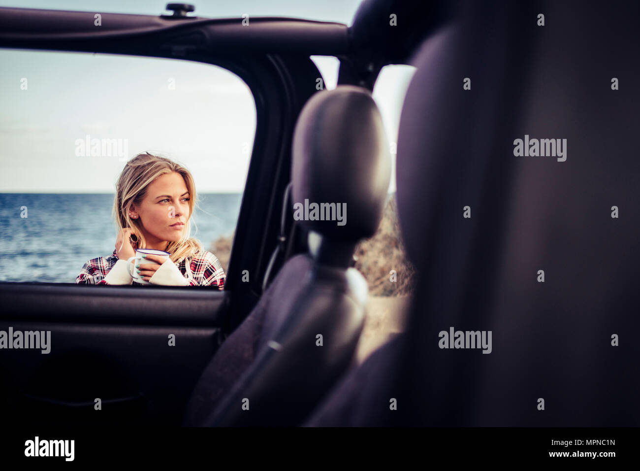 travel and journey wanderlust concept with young blonde female taking a