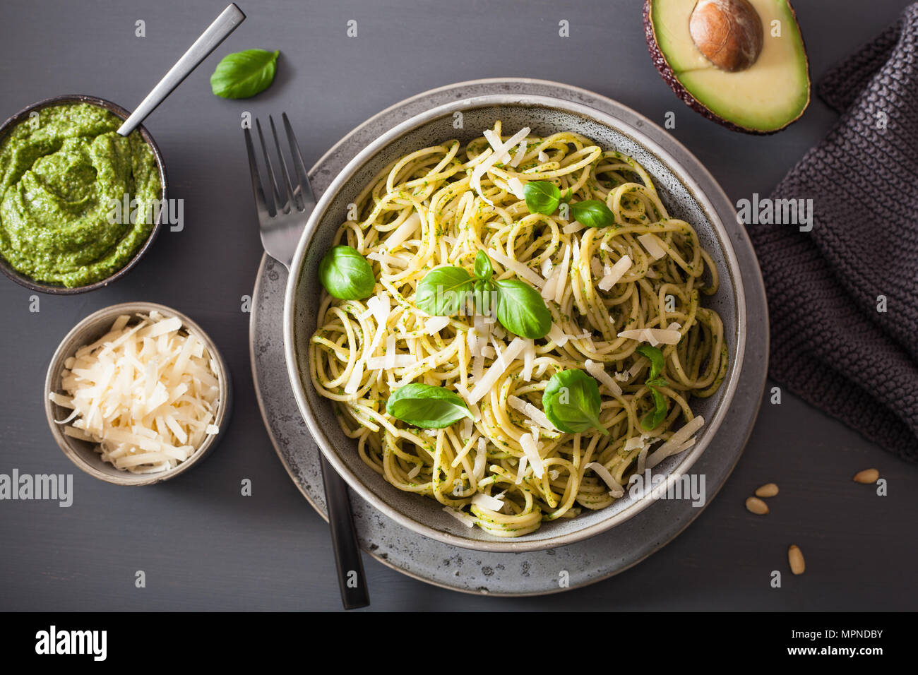 spaghetti pasta with avocado basil pesto sauce Stock Photo Alamy