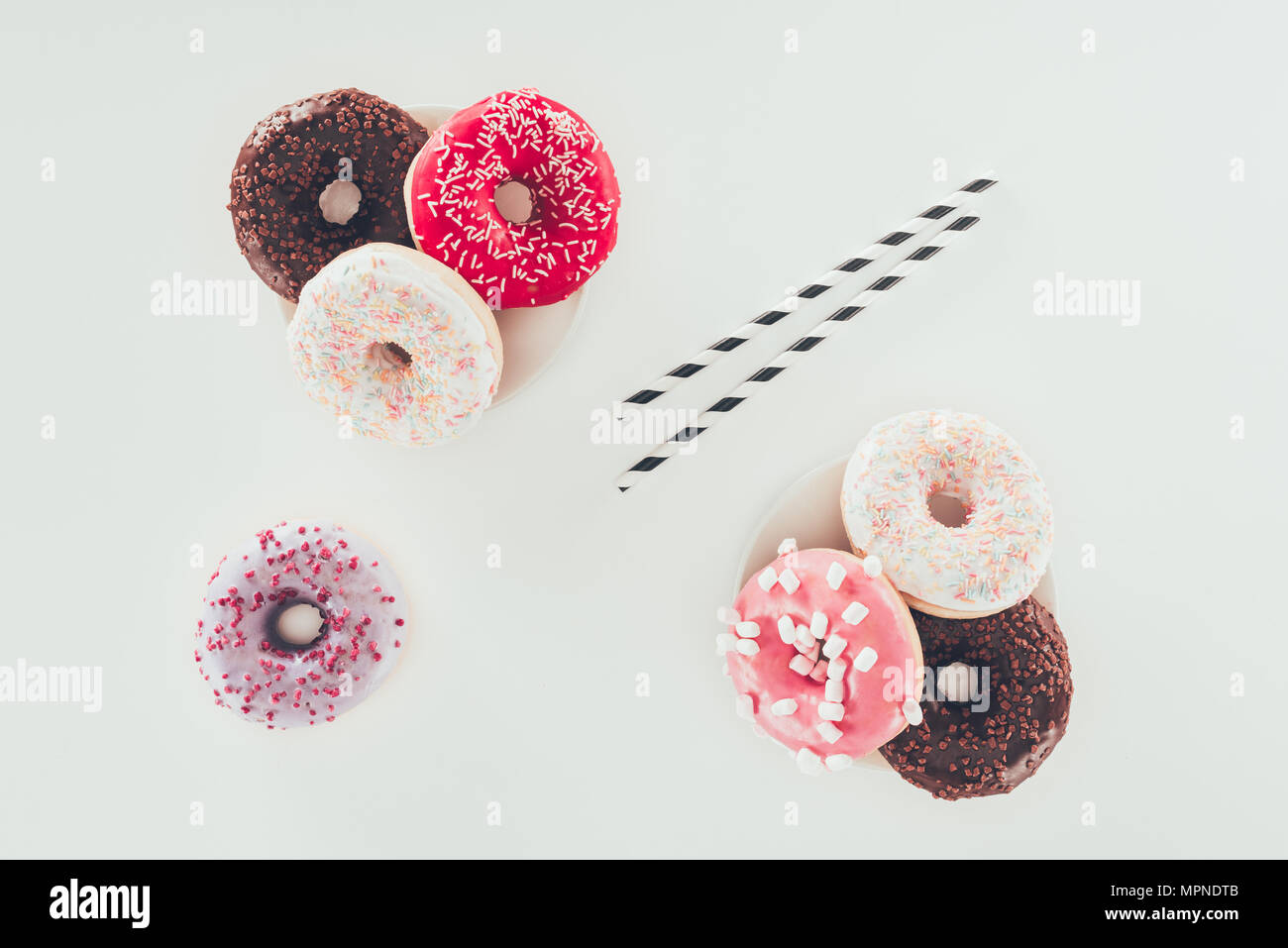 top view of tasty various doughnuts on white surface Stock Photo - Alamy