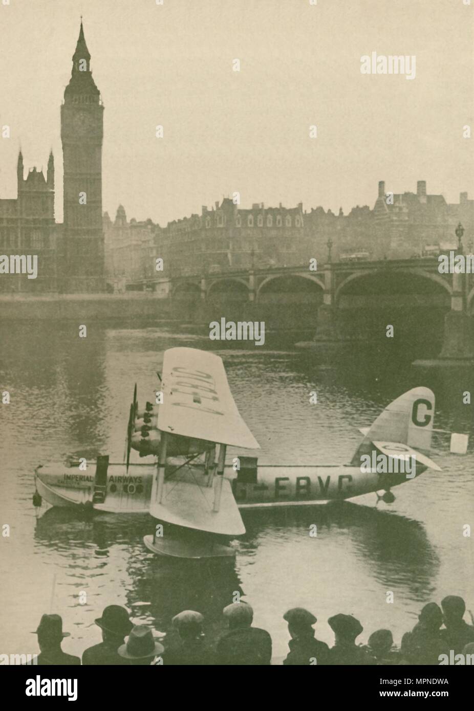 'The 'Calcutta' Flying-Boat Moored in the Thames opposite the Houses of Parliament', 1927. Artist: Unknown. Stock Photo