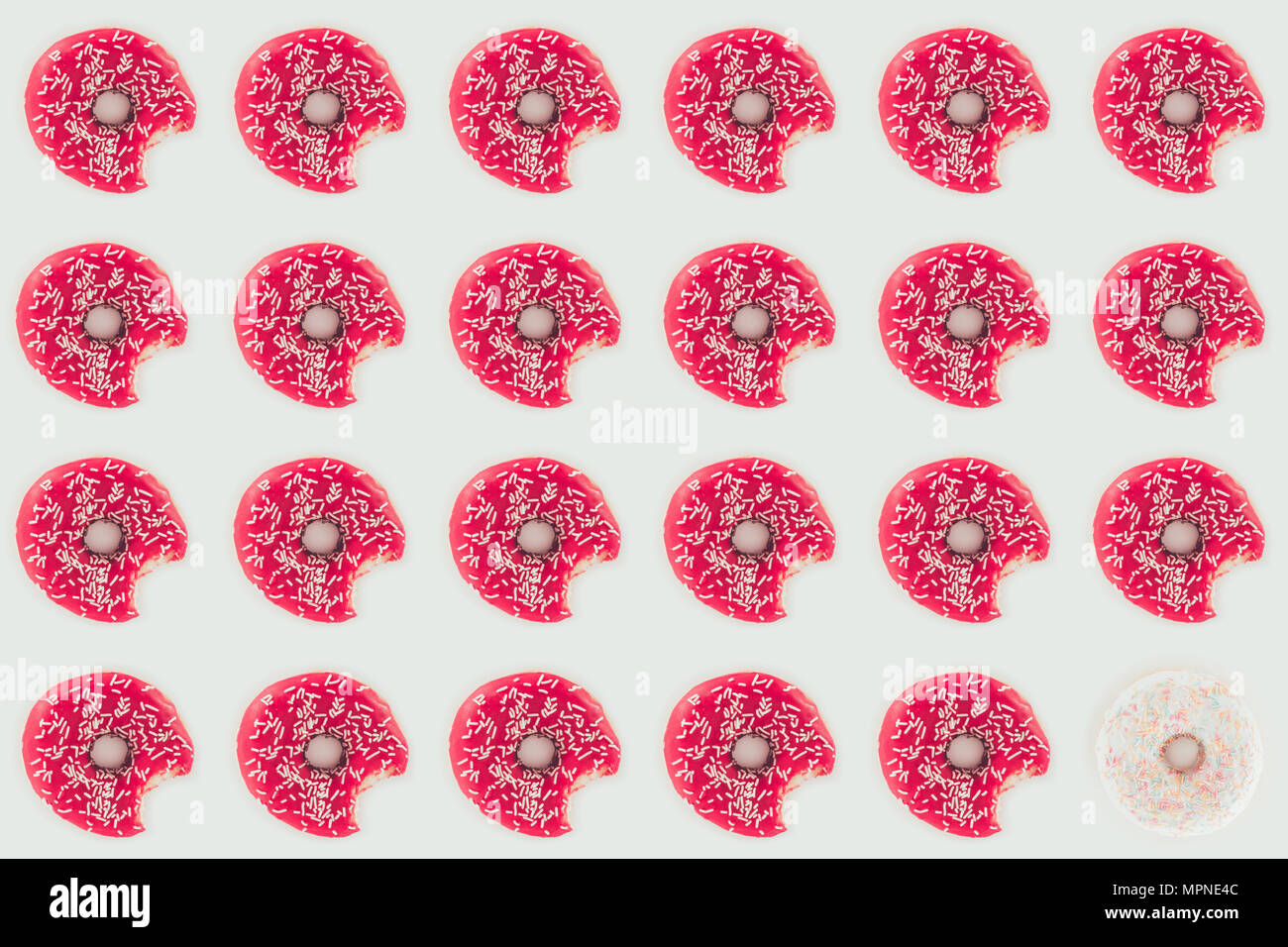 top view of pink glazed doughnuts seamless pattern isolated on white ...