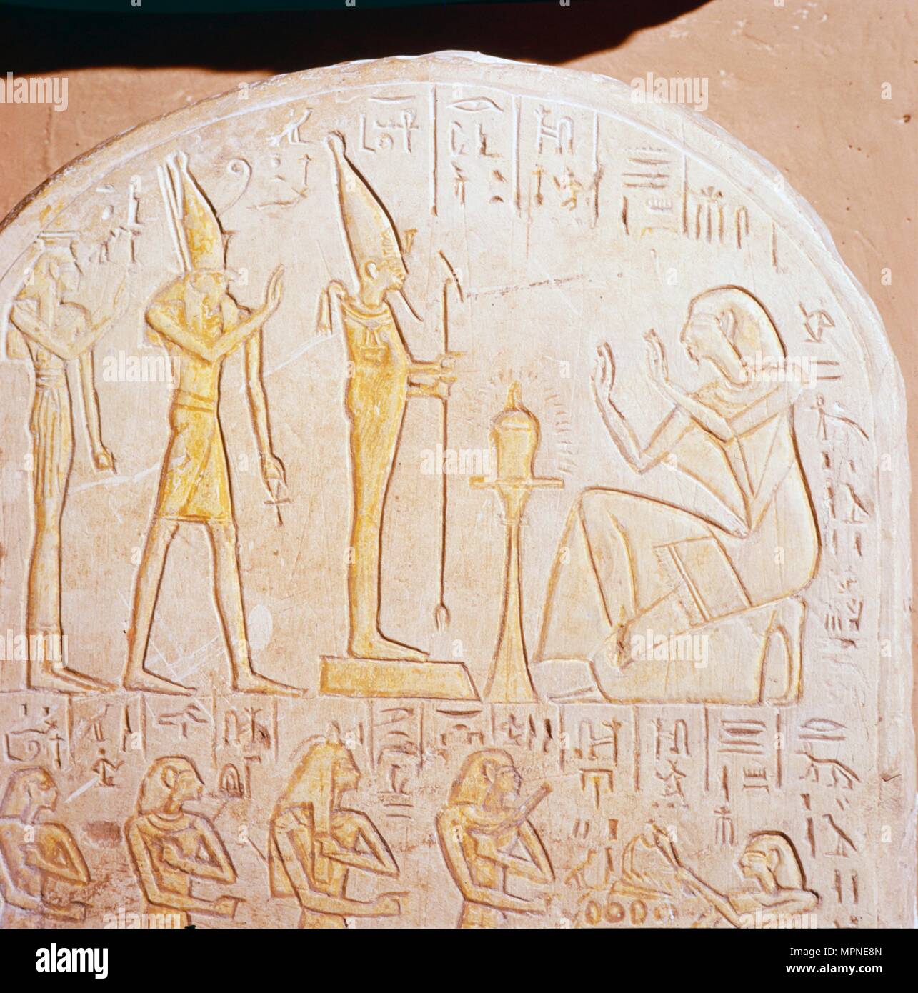 Egyptian stele, Deceased worships Osiris who stands on pedestal representing Maat. Artist: Unknown. Stock Photo
