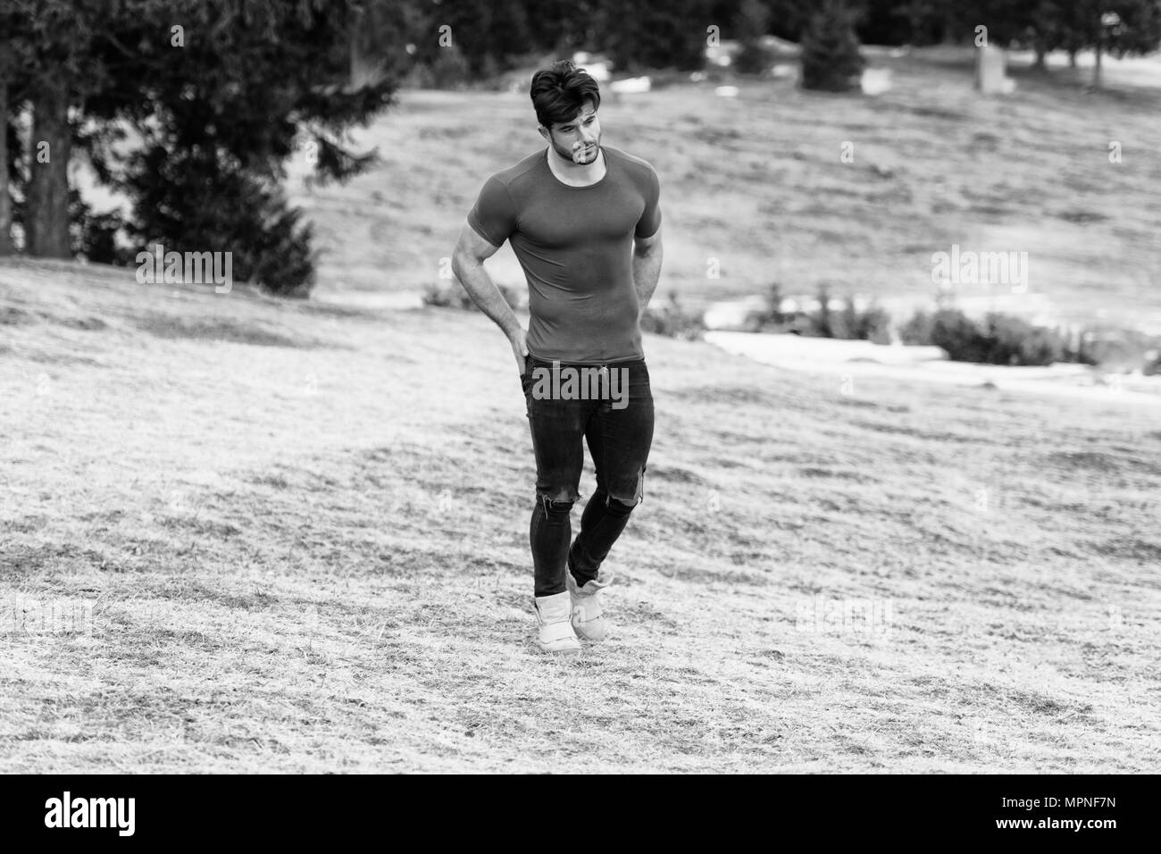Man muscles t shirt Black and White Stock Photos & Images - Alamy