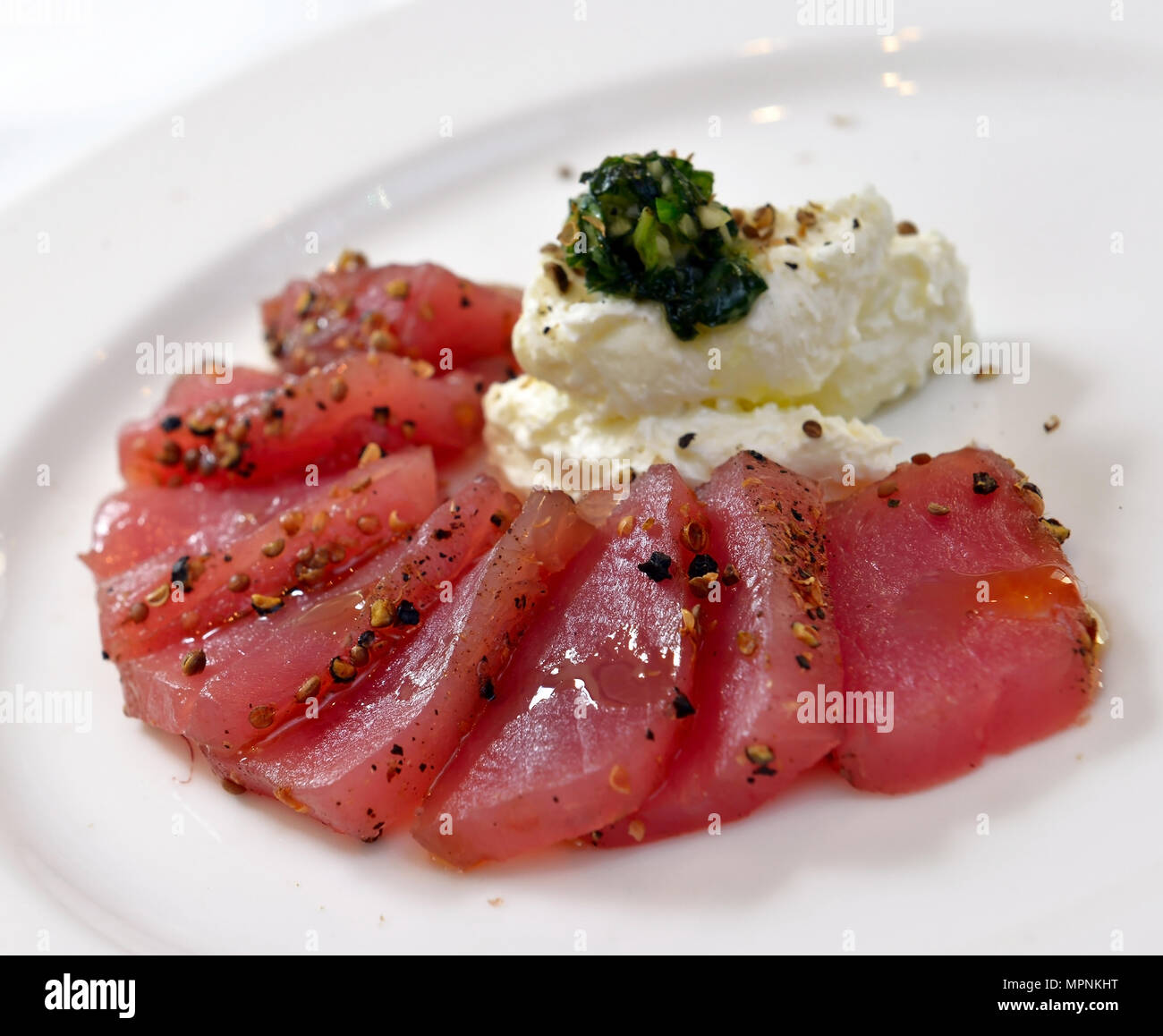 tuna carpaccio with cheese garlic and basil Stock Photo Alamy