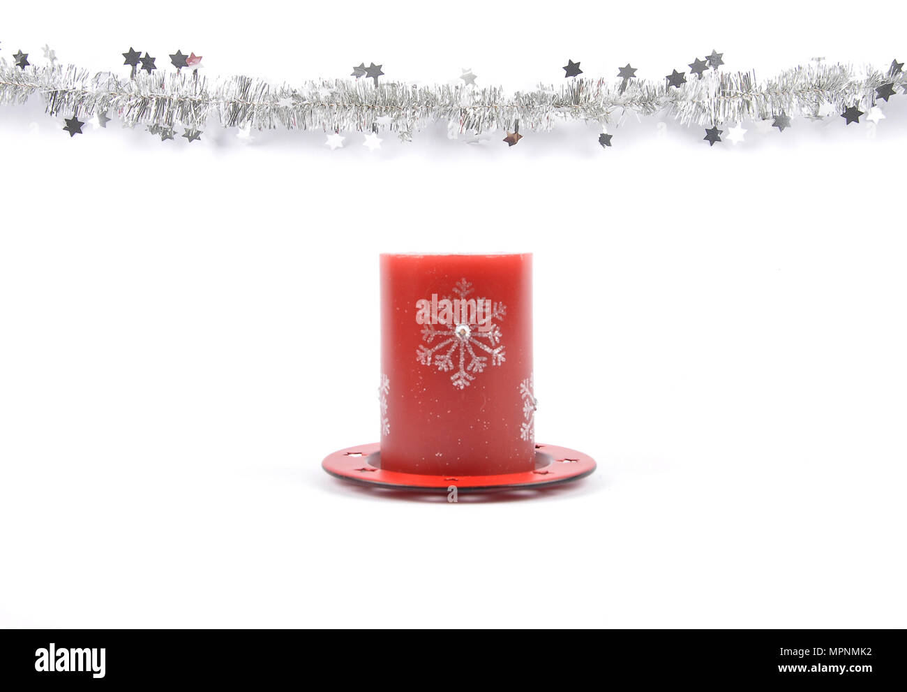 Christmas garland and candle on white Stock Photo Alamy