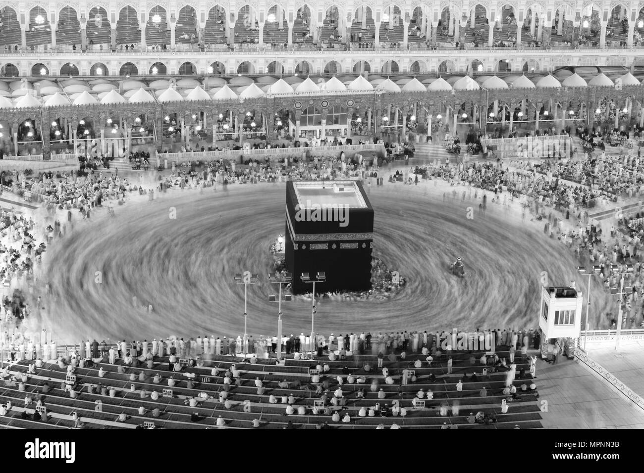 Prayer and Tawaf - circumambulation - of Muslims Around AlKaaba in Mecca, Saudi Arabia, Aerial Top View Stock Photo