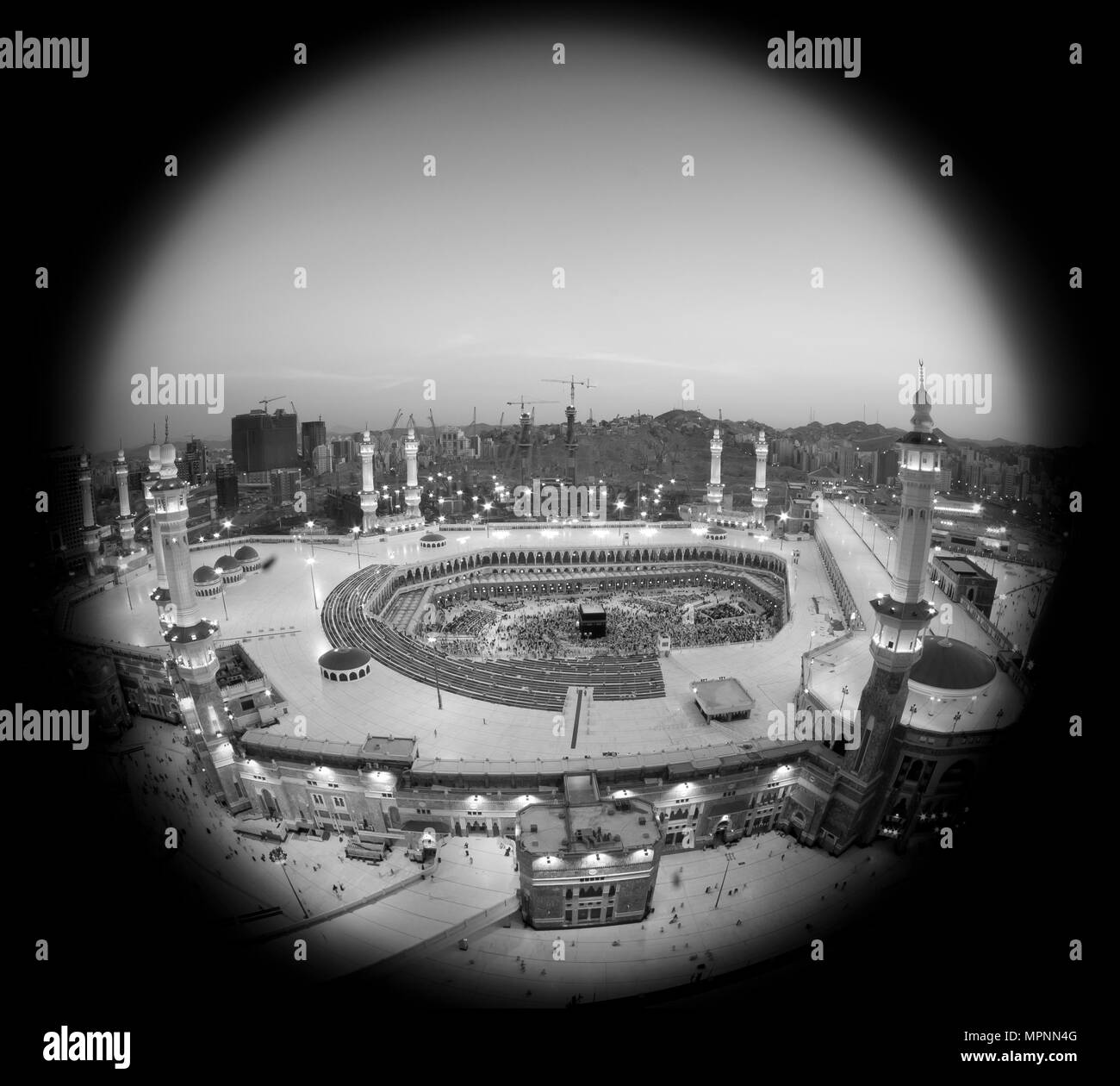 Prayer and Tawaf - circumambulation - of Muslims Around AlKaaba in Mecca, Saudi Arabia, Aerial Top View Stock Photo