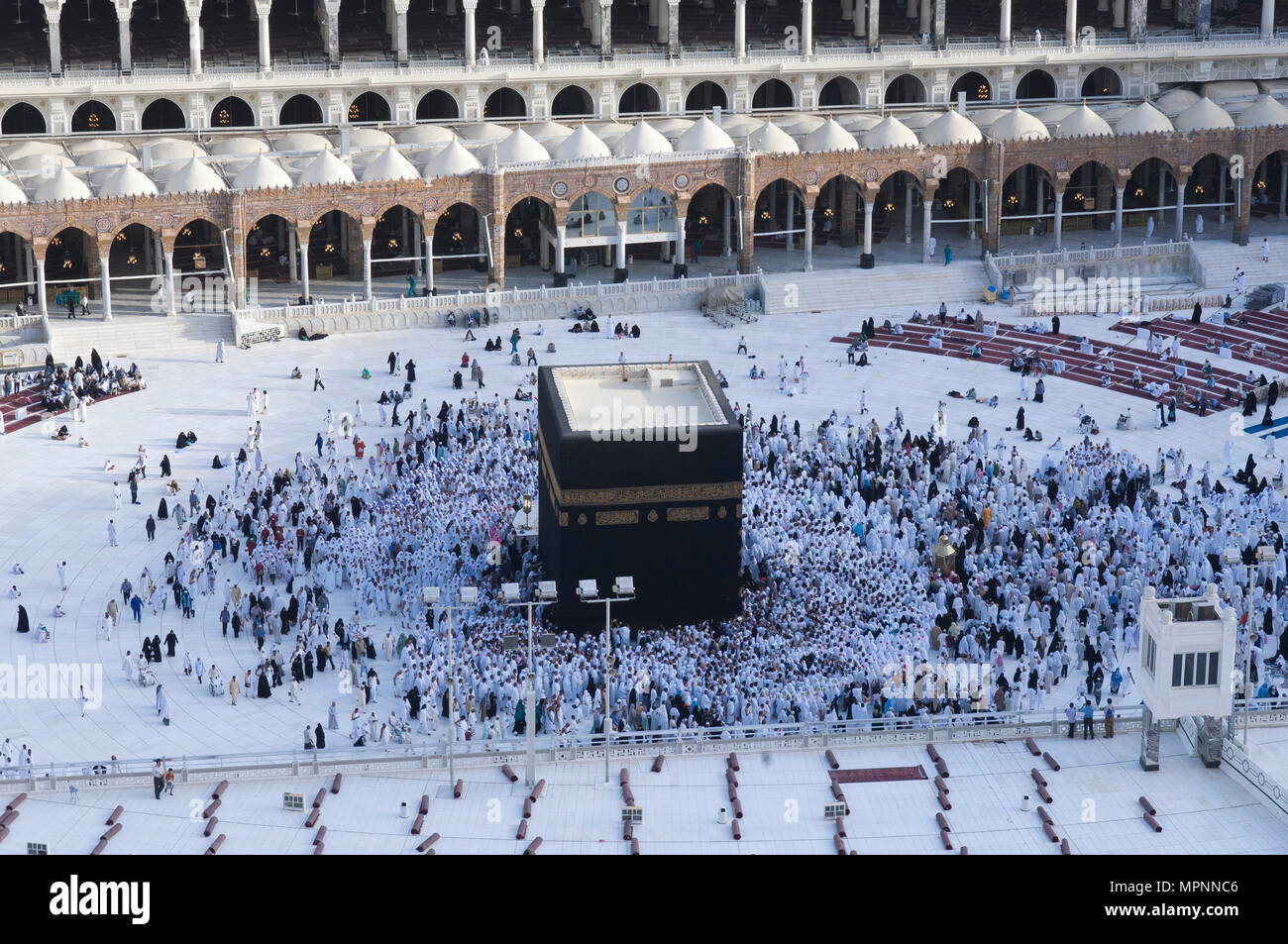 Prayer and Tawaf of Muslims Around AlKaaba in Mecca, Saudi Arabia, Aerial Top View Stock Photo