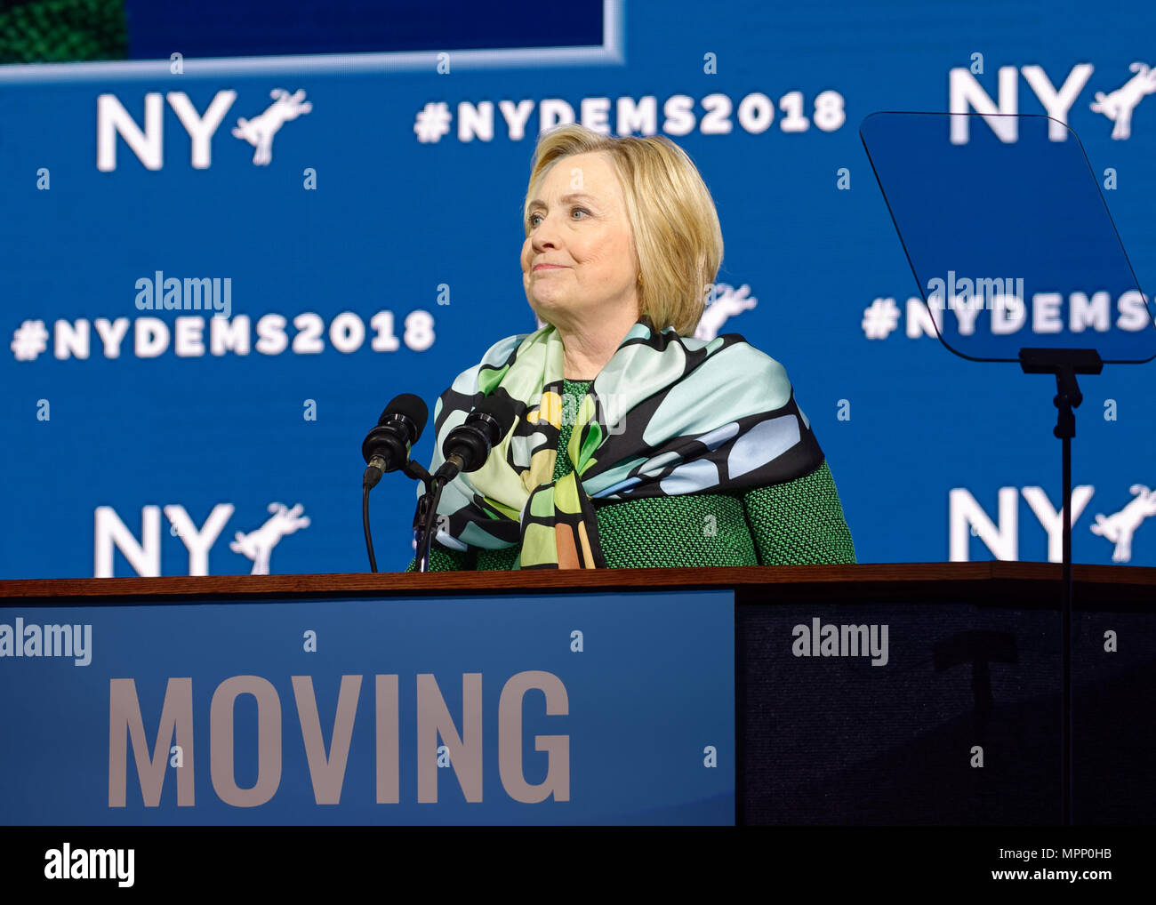 Long Island, USA. 23rd May, 2018. HILLARY CLINTON, with lips pursed, delivers Keynote Address during Day 1 of New York State Democratic Convention, held at Hofstra University on Long Island. Clinton, the former First Lady and NYS Senator, endorsed the re-election of Gov. A. Cuomo for a third term, and mentioned how Hofstra was the site of her first 2016 debate with Trump. Credit: Ann E Parry/Alamy Live News Stock Photo