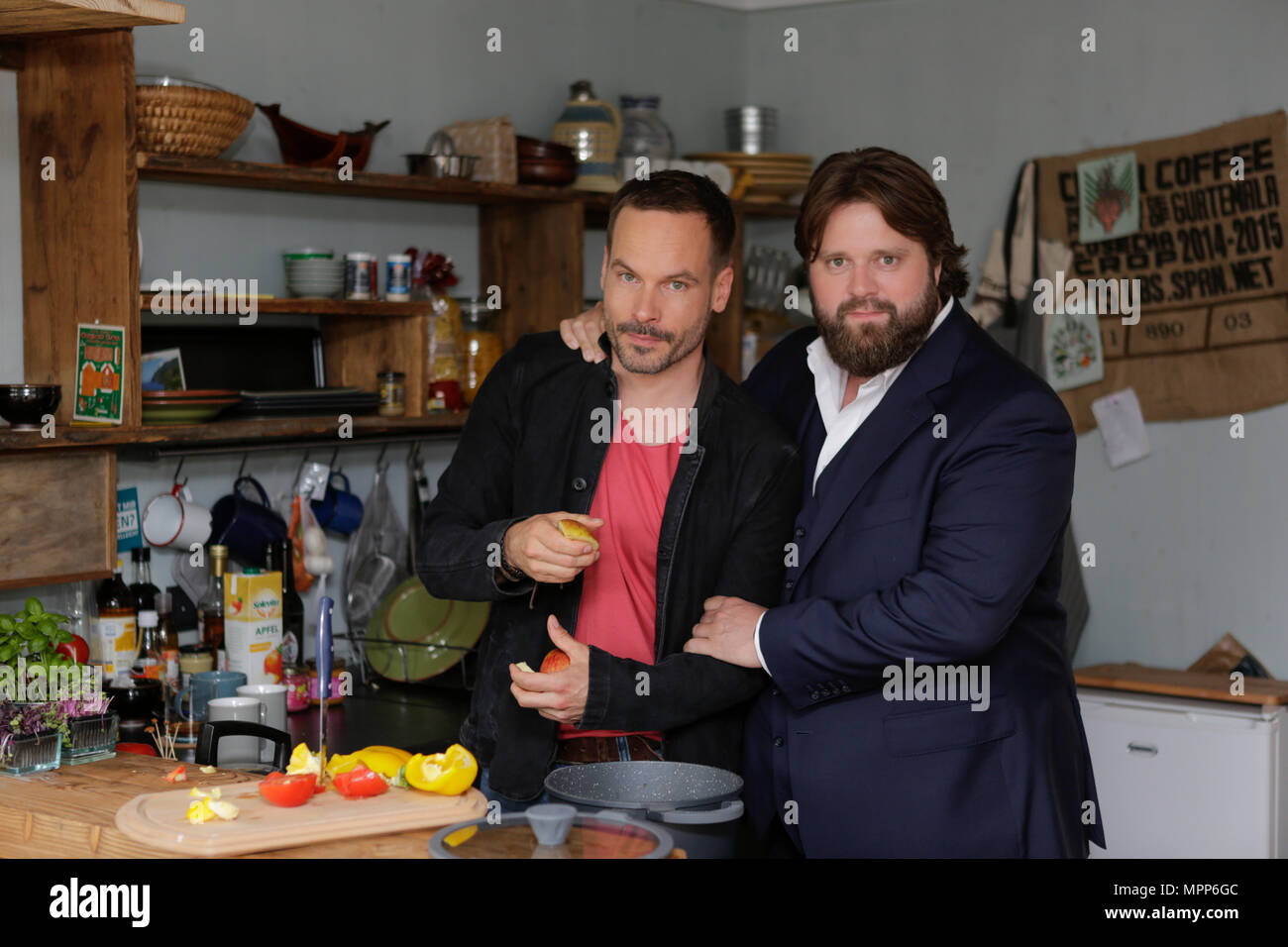 Frankfurt, Germany. 24th May 2018. Actors Wanja Mues (left) an (Antoine Monot, Jr. (right) pose in the kitchen of  the houseboat that is owned by Mues' character Leo in the TV show preparing food. 4 new episodes of the relaunch of the long running TV series 'Ein Fall fuer zwei’ (A case for two) are being filmed in Frankfurt for the German state TV broadcaster ZDF (Zweites Deutsches Fernsehen). It stars Antoine Monot, Jr. as defence attorney Benjamin ‘Benni’ Hornberg and Wanja Mues as private investigator Leo Oswald. The episodes are directed by Thomas Nennstiel. The episodes are set to air in  Stock Photo