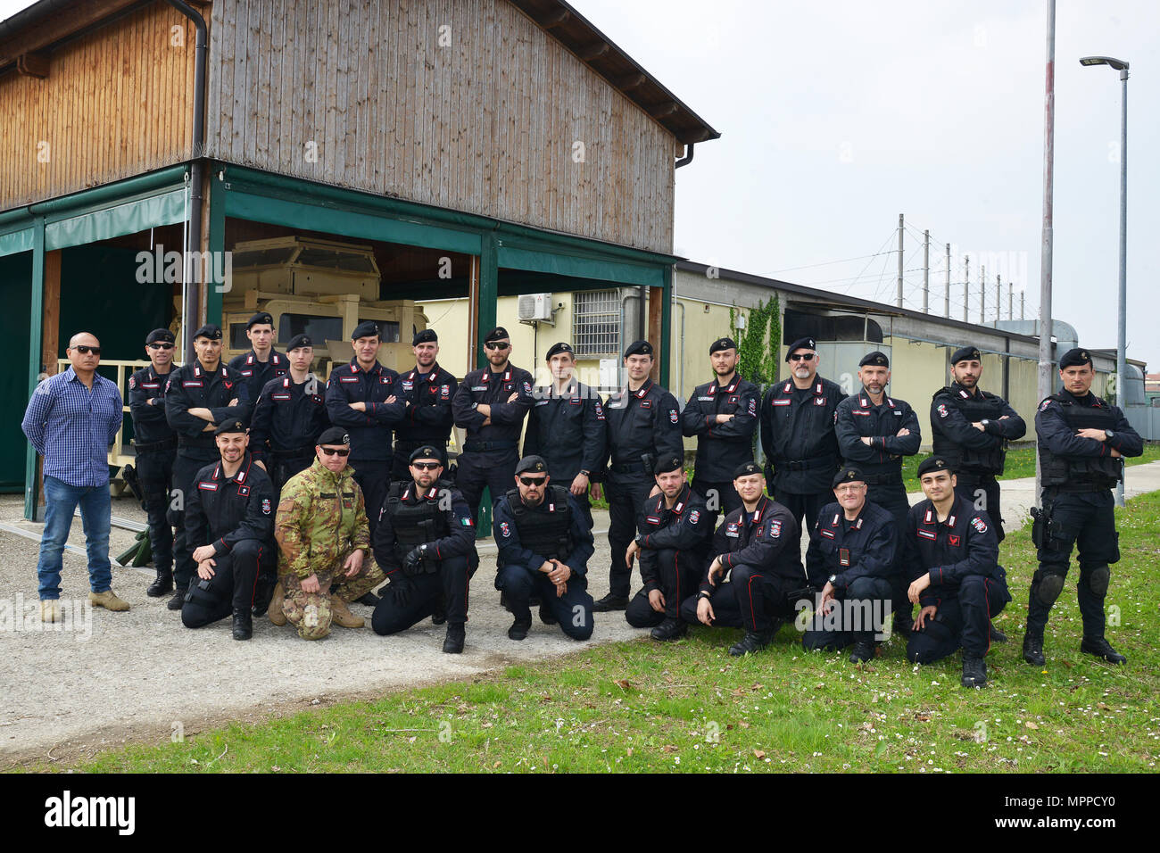 Italian Carabinieri of the 7th Regiment Carabinieri “Laives” Bolzano and 13th Regiment Carabinieri “Friuli Venezia Giulia” Gorizia, pose for a group photo, during the training at Caserma Ederle Vicenza, Italy, April 6, 2017. Carabinieri use U.S. Army RTSD South equipment to enhance the bilateral relations and to expand levels of cooperation and the capacity of the personnel involved in joint operations. (U.S. Army photo by Visual Information Specialist Paolo Bovo/released) Stock Photo
