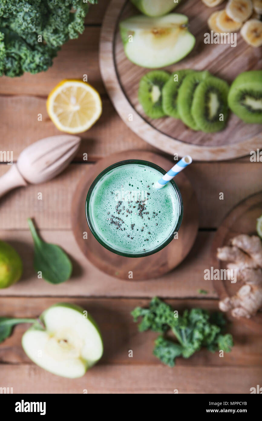 Green smoothie surrounded by ingredients Stock Photo