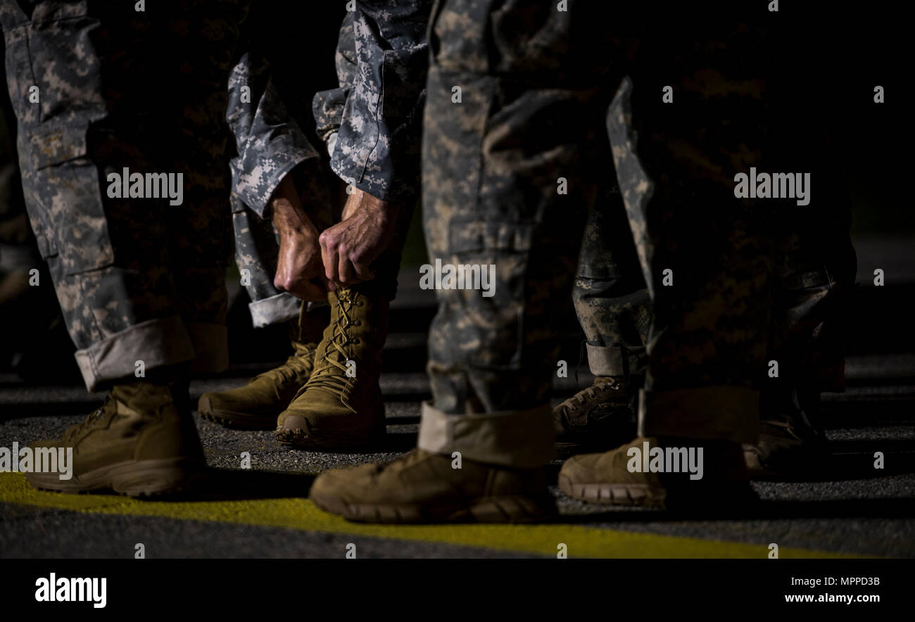 A U.S. Army ranger ties his boots in preparation for the first event of the  Best Ranger Competition 2017 in Camp Rogers, Ga., April 7, 2017. The 34th  annual David E. Grange