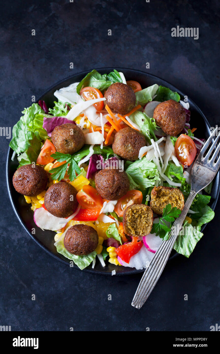 Bowl of mixed salad with vegetable balls Stock Photo