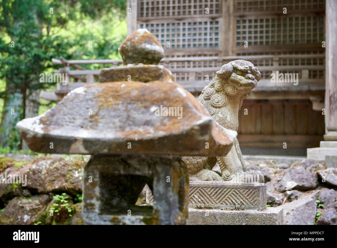Ungyo komainu statue outside Towada Shinto shrine. The liondoglike
