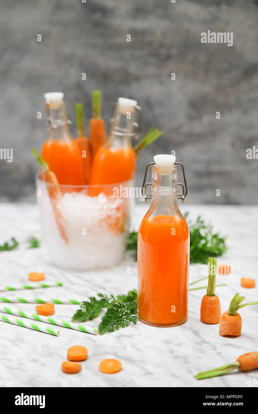 Refreshing carrot juice on marble Stock Photo