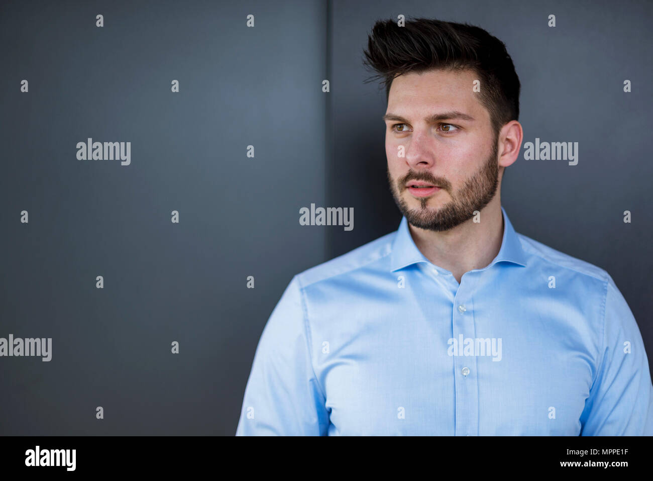 Bearded businessman looking away Stock Photo