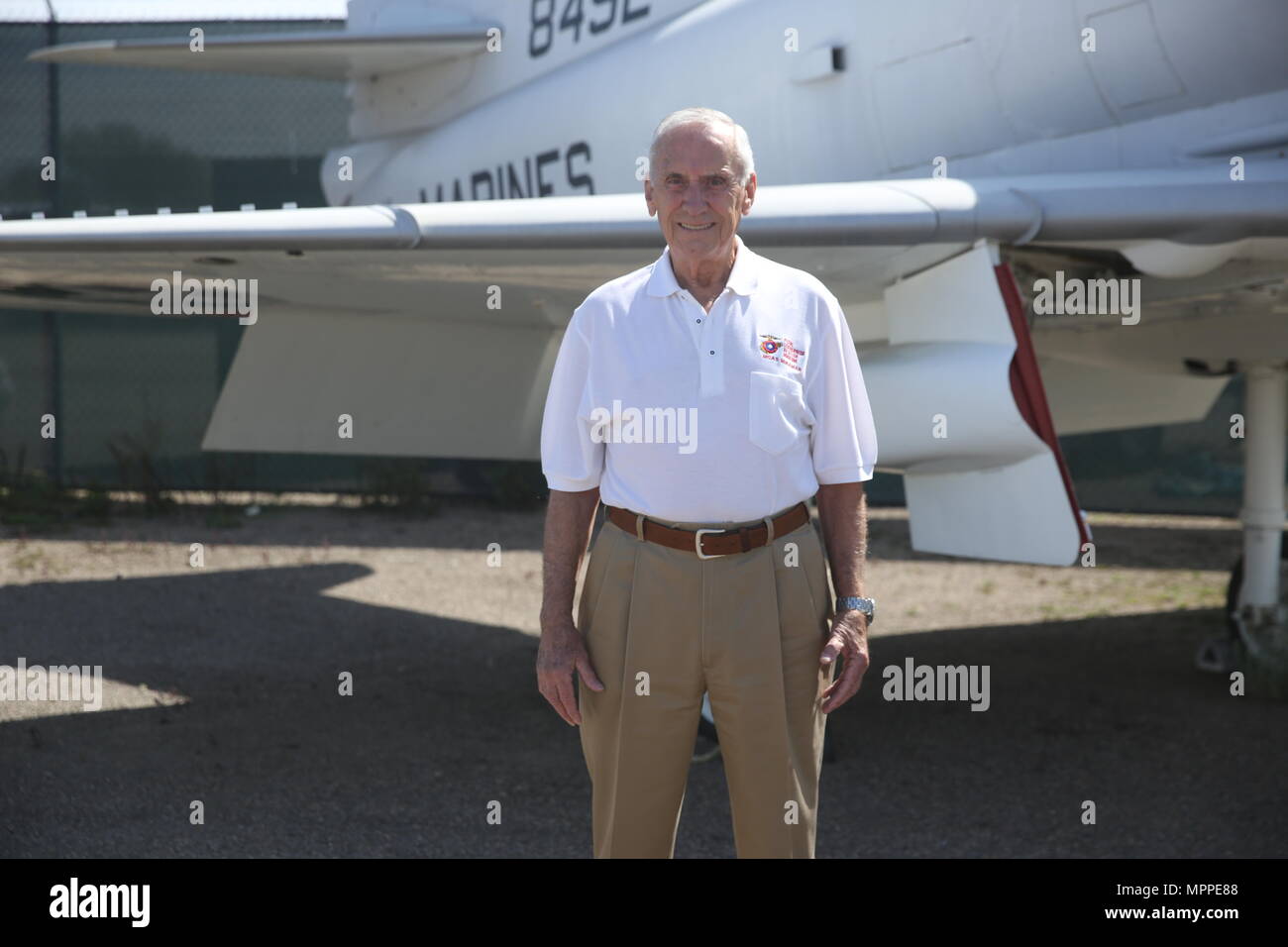 Retired Maj. Gen. Bobby Butcher stands beside a Douglas A-4C Skyhawk at The Flying Leatherneck Aviation Museum just outside Marine Corps Air Station Miramar, Calif., April 6. Butcher flew the Skyhawk towards the end of his tour as a Vietnam pilot. (U.S. Marine Corps photo by Sgt. David Bickel/Released) Stock Photo