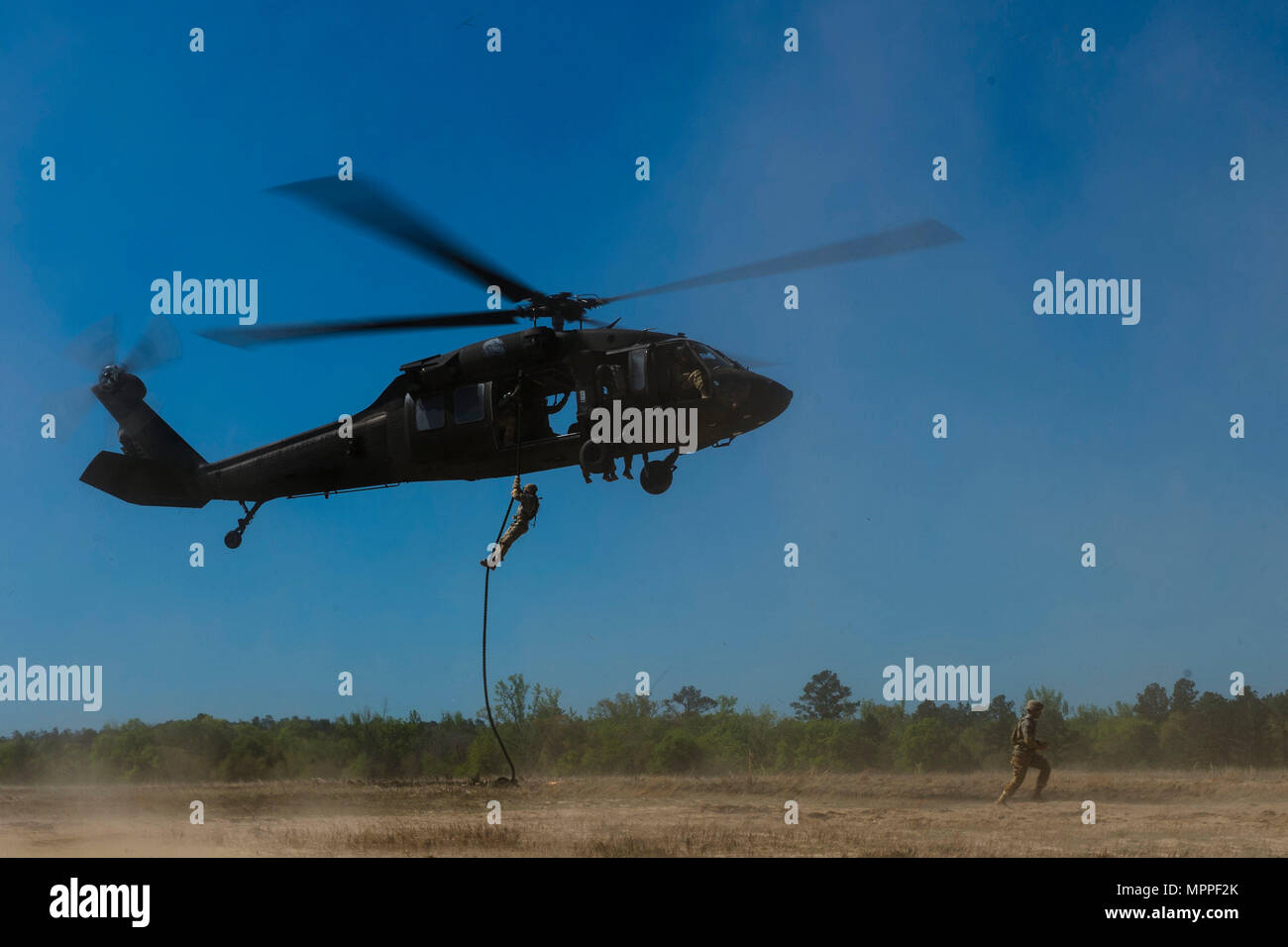 Army Rangers Rappelling U.S. Army Rangers rappel out of a U.S. Army UH-60 Black Hawk during the ...