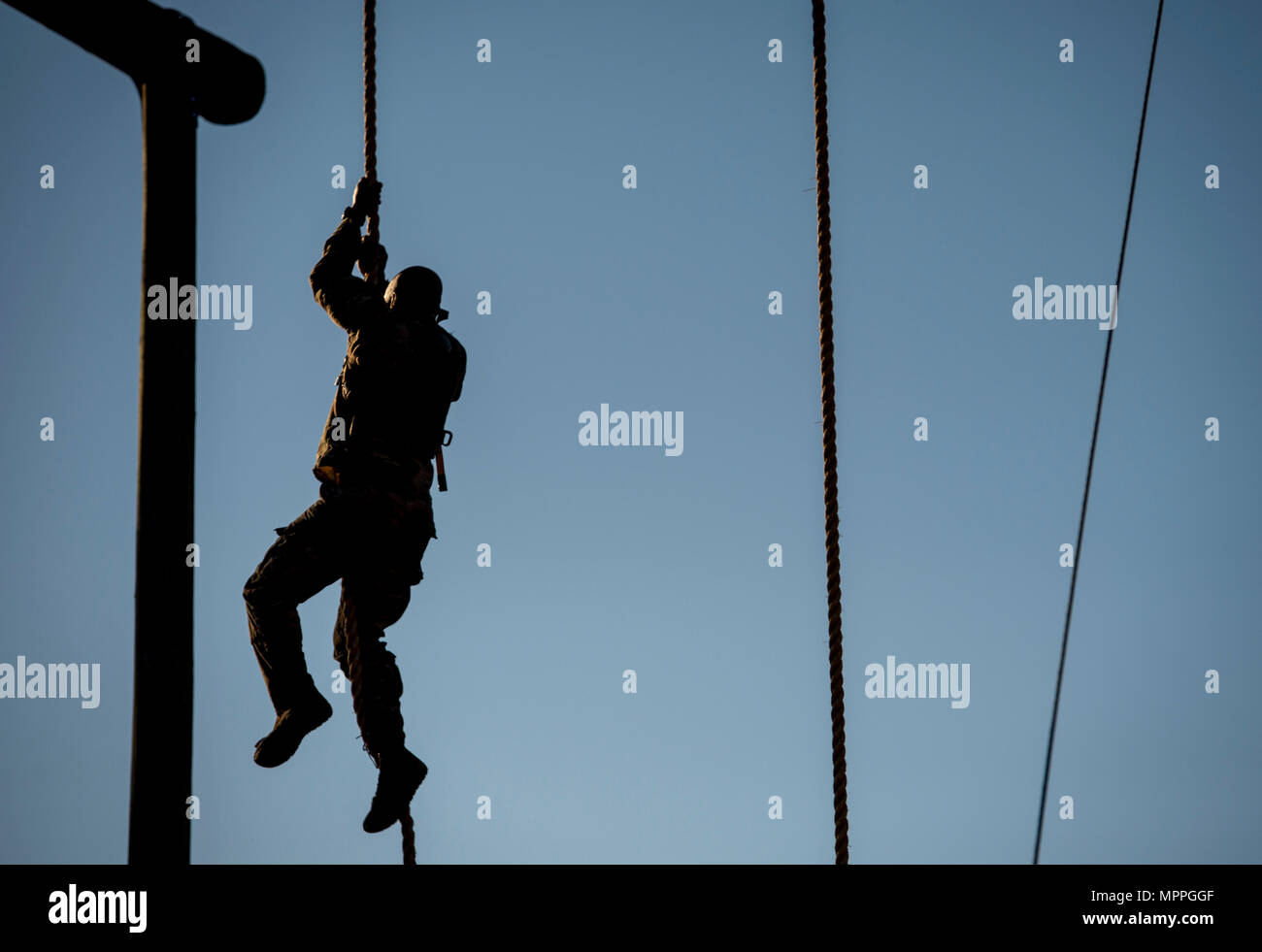 A U.S. Army Ranger climbs a rope obstacle during the Best Ranger ...