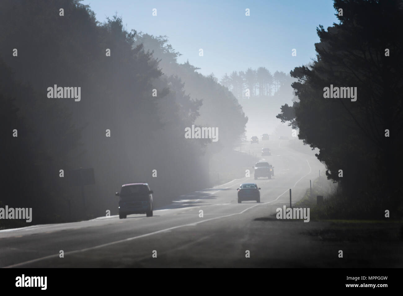 Lincoln City, Oregon, USA January 25, 2015 Cars drive in coastal fog