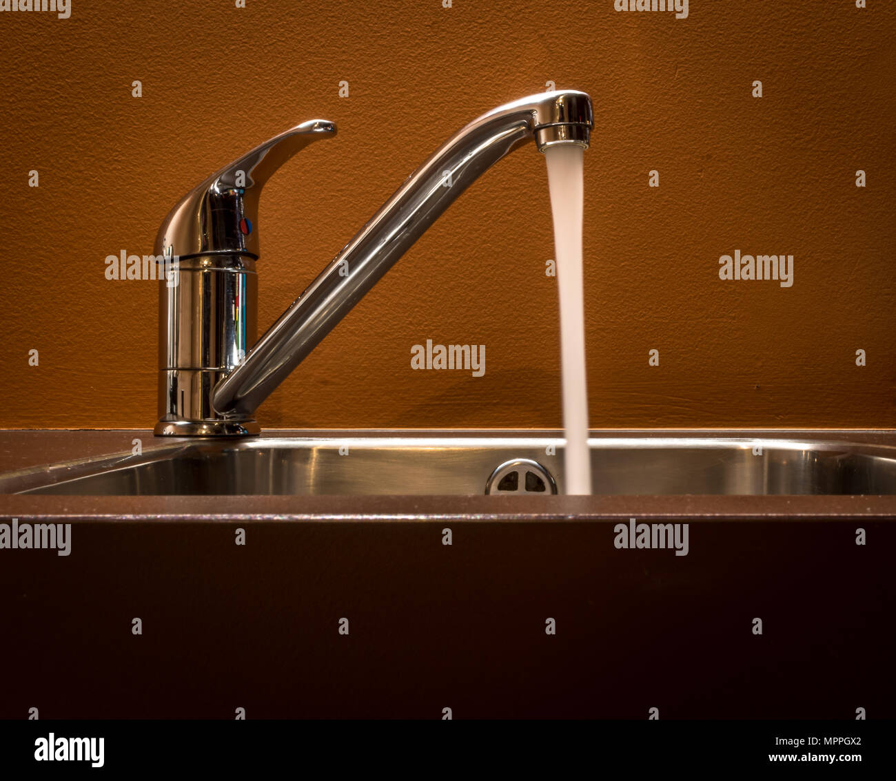 Tap left open on the kitchen sink Stock Photo Alamy