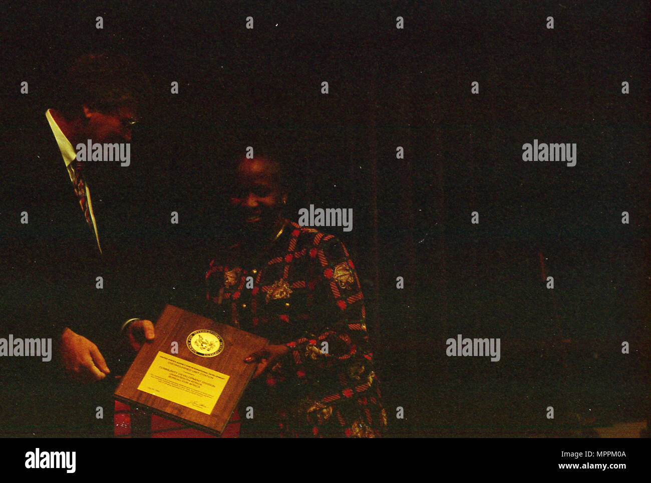 Admin. Atwood contact sheet CFC; Health Fair Woman on stage receiving