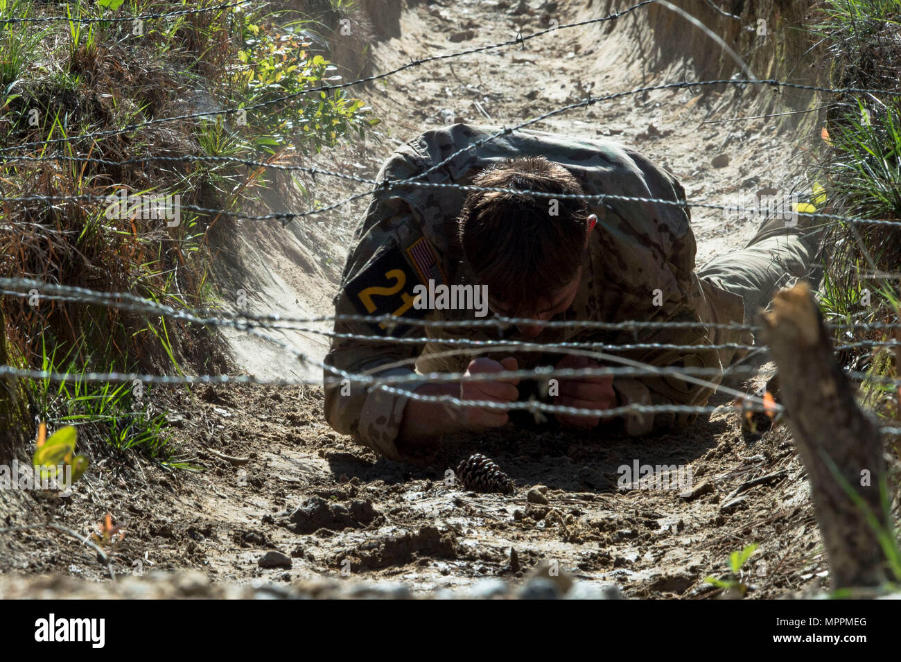 Army Ranger Ladder Man A U.S. Army Ranger from the 7th Infantry Division low-crawls under ...