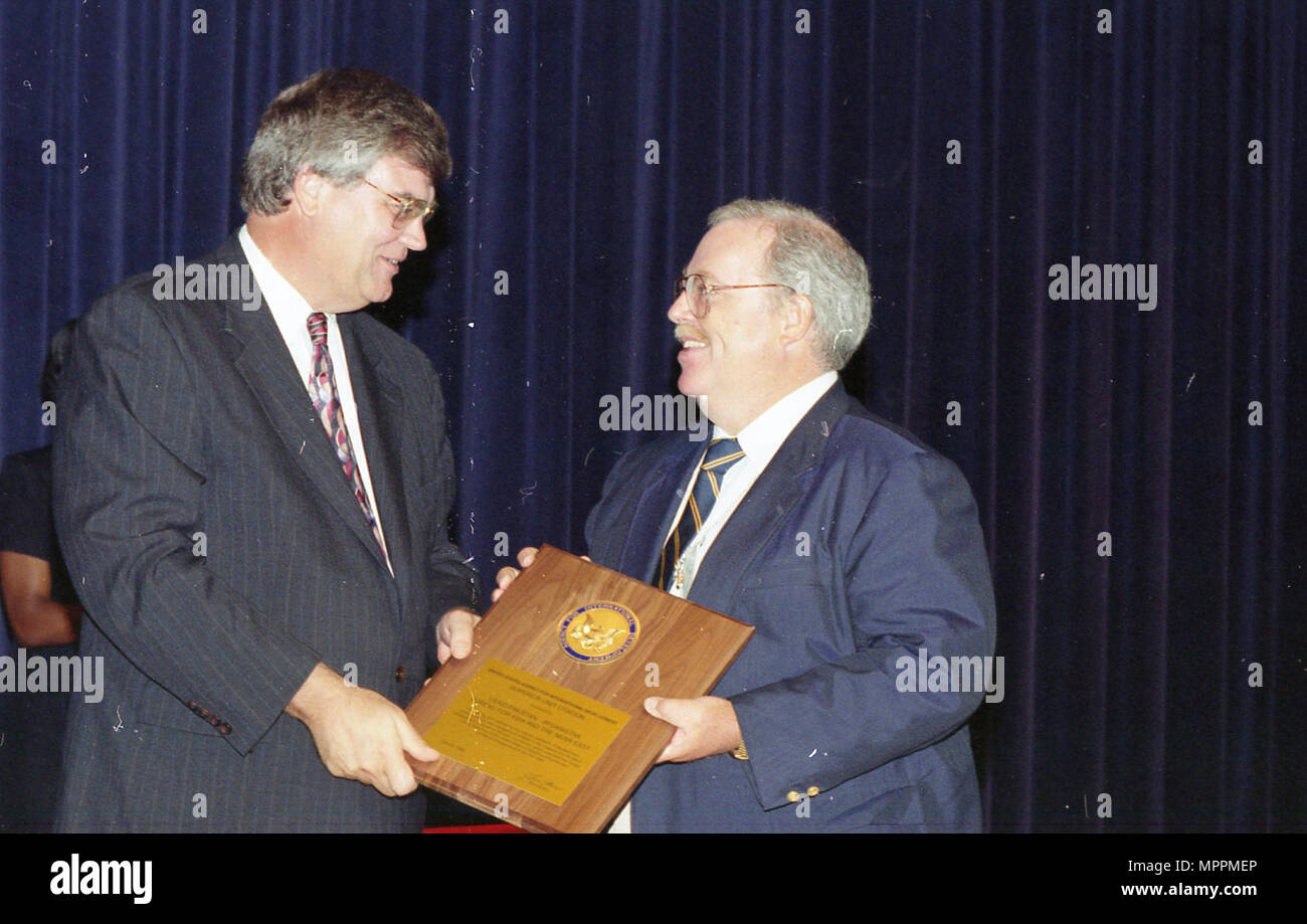 Admin. Atwood contact sheet CFC; Health Fair Man on stage receiving