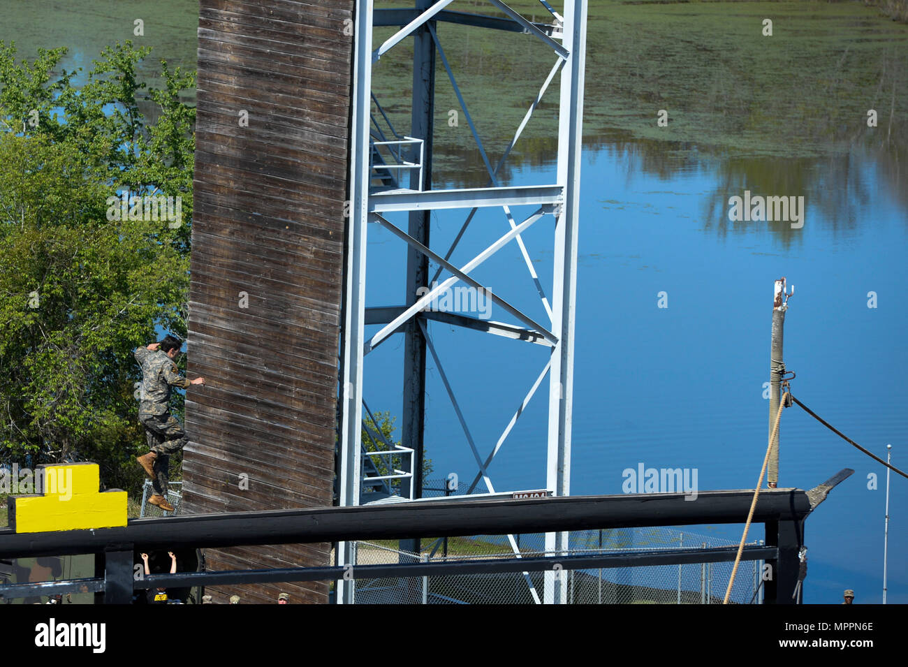 A U.S. Army Ranger crosses a balance beam over Victory Pond during the ...