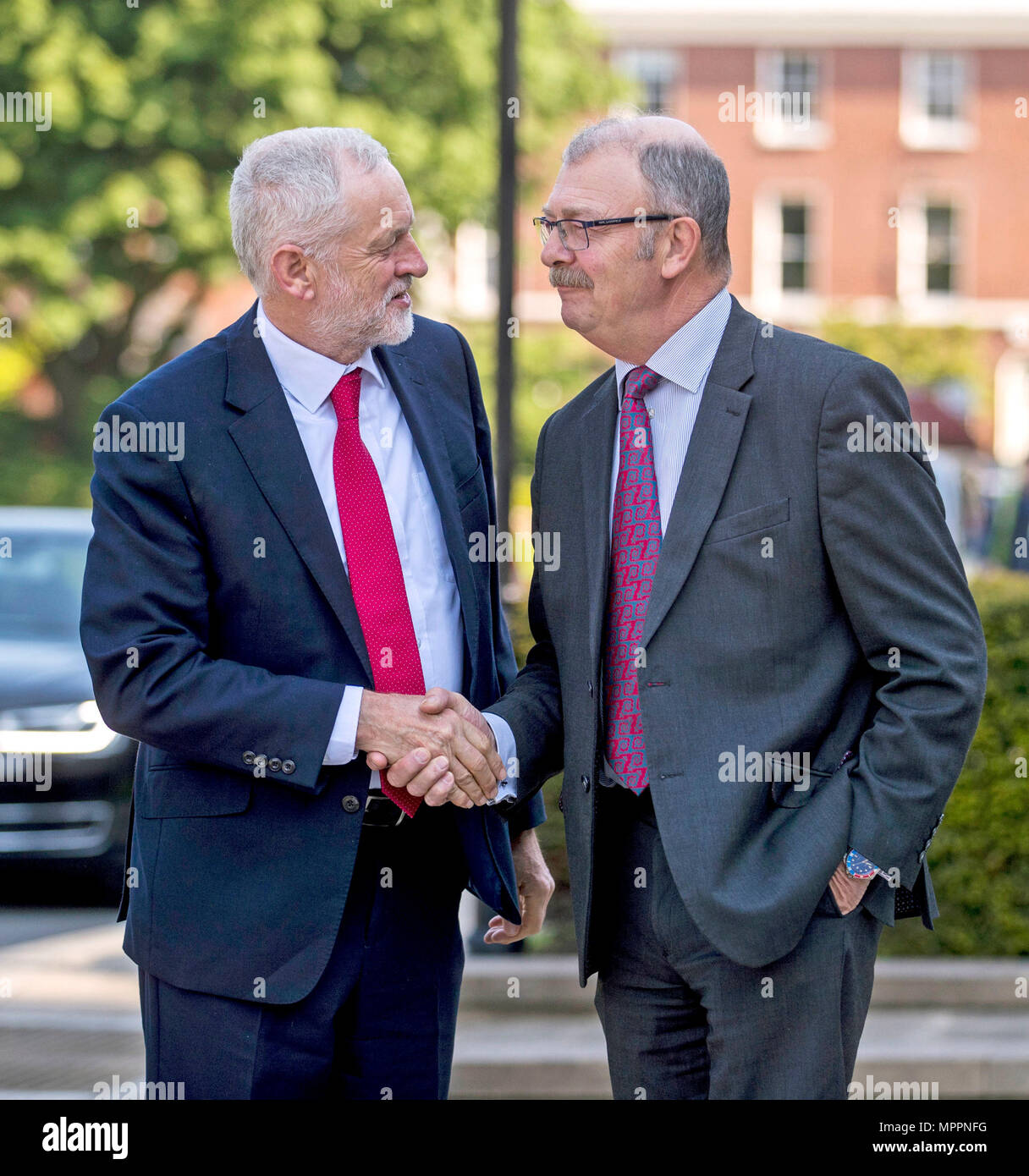 Labour leader Jeremy Corbyn is greeted by Professor James McElnay, Acting Vice-Chancellor at Queen's University in Belfast, ahead of delivering a public lecture in the Great Hall. Stock Photo