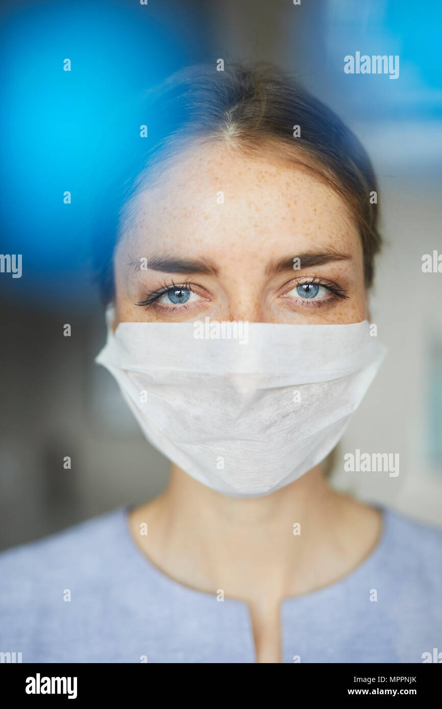 Portrait of woman wearing surgical mask Stock Photo Alamy