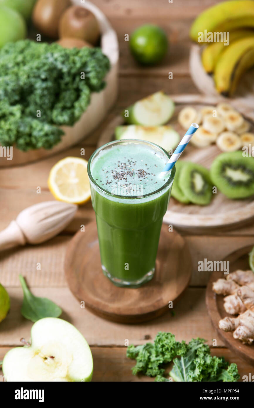 Green smoothie surrounded by ingredients Stock Photo