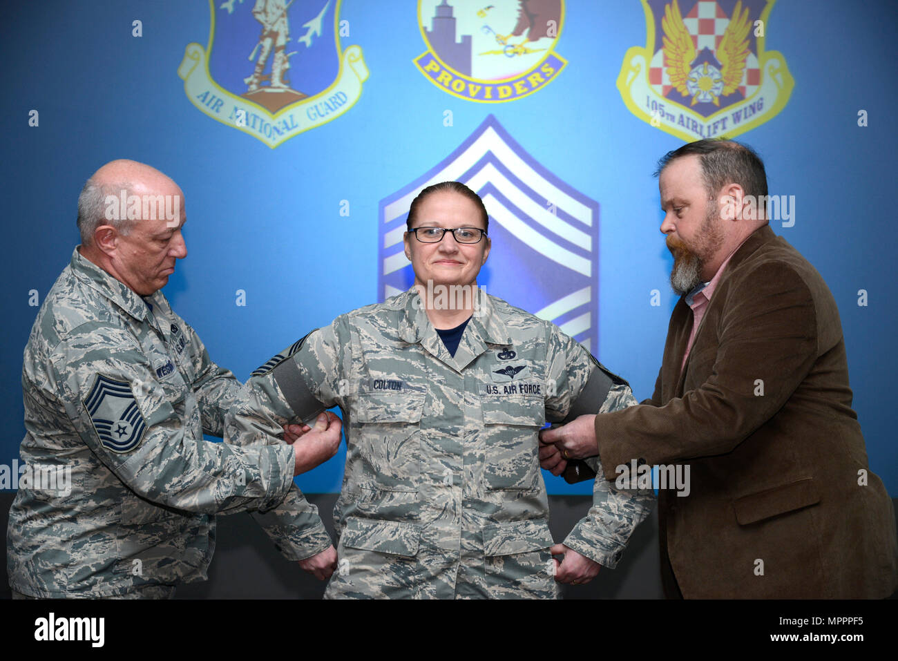 Chief Master Sgt. Elizabeth A. Colton, the air terminal superintendent assigned to the 105th Airlift Wing, is promoted during a ceremony at Stewart Air National Guard Base, New York April 1, 2017. Stock Photo