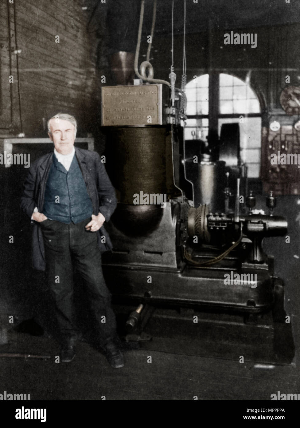 Thomas Alva Edison, American inventor, with his first dynamo for producing electric light, 1880s. Artist: Unknown. Stock Photo
