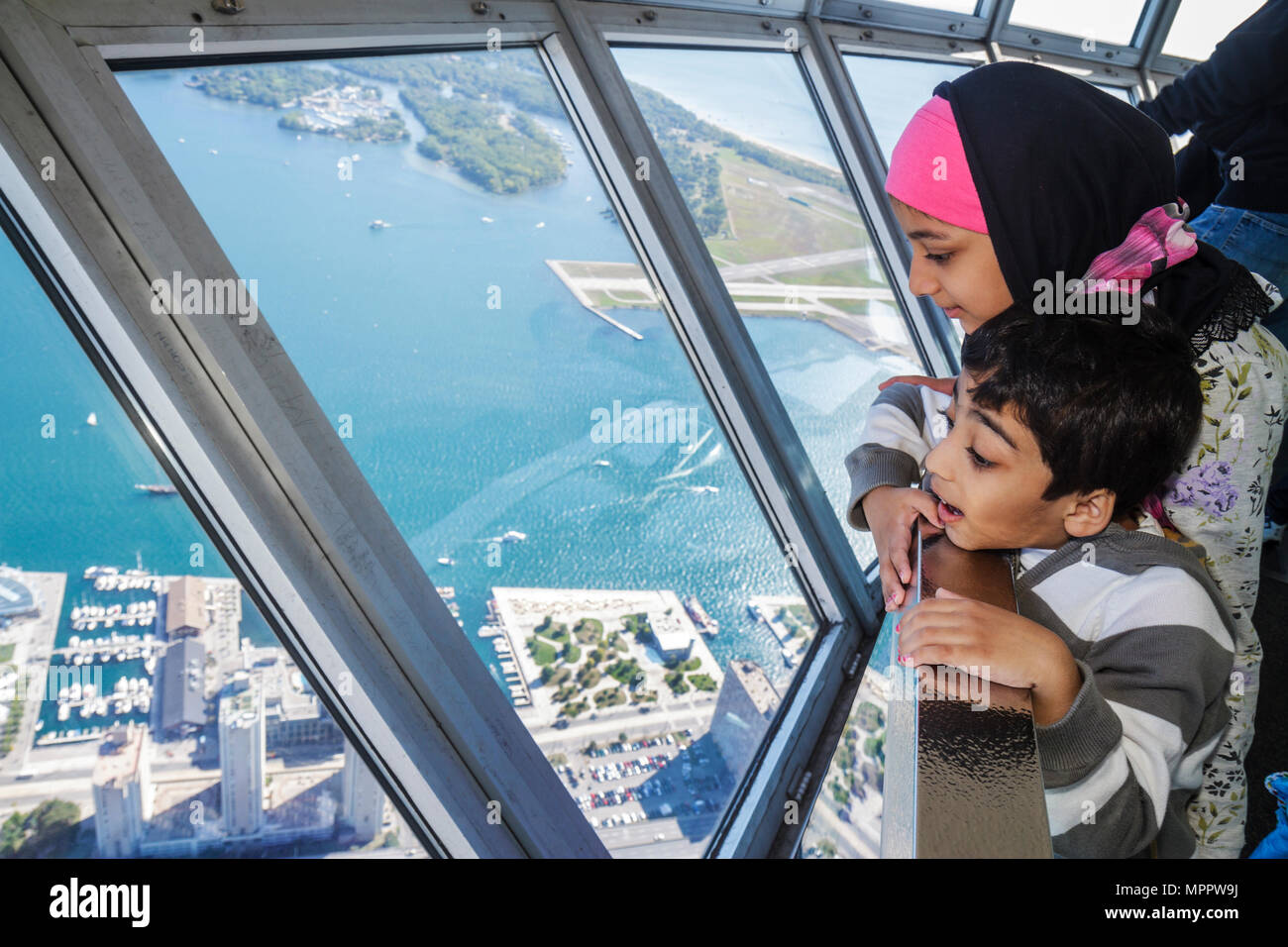 Toronto Canada,Bremner Boulevard,CN Tower,observation towermodern wonder,Sky Pod,window view south,Lake Ontario,Toronto Island,Islands,Asian Muslim,gi Stock Photo