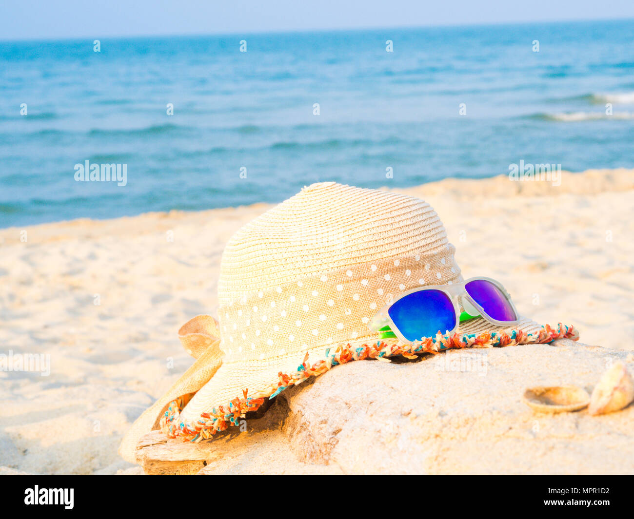 hat and sunglasses on the beach with sea backround, Concept of summer ...