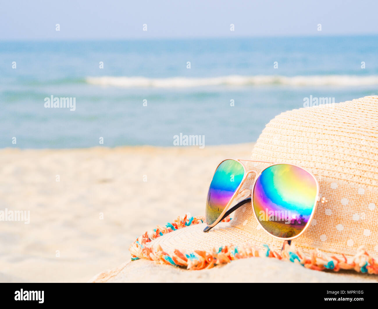 hat and sunglasses on the beach with sea backround, Concept of summer ...
