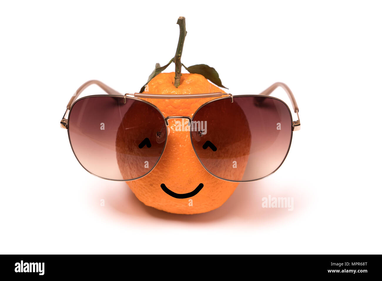 smiley orange wearing the eyeglasses on white backgrounds. cartoon emotion face orange isolated Stock Photo