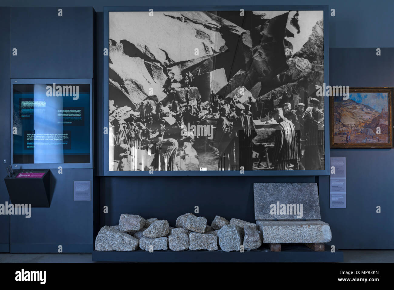 Original photo, inmates in the quarry, among them original broken out stones, exhibited in the concentration camp memorial Stock Photo