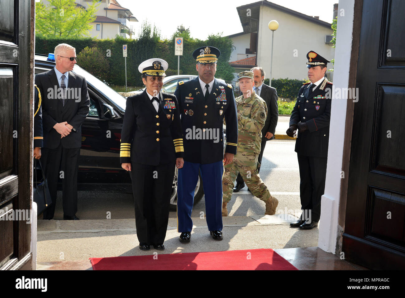 Admiral Michelle Howard (left), NATO JFC-Naples Commander, and U.S. Army Col. Darius S. Gallegos (right), CoESPU deputy director, render salutes during the playing anthems during visit at the Center of Excellence for Stability Police Units (CoESPU) Vicenza, April 10, 2017. (U.S. Army Photo by Visual Information Specialist Paolo Bovo/released) Stock Photo