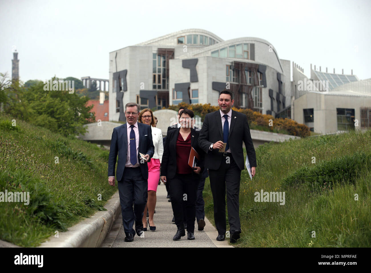 Scottish Conservative leader Ruth Davidson (centre), arrives alongside other MSPs to spread poppy seeds in the grounds of the Scottish Parliament in Edinburgh, to create a Garden of Remembrance which is part of the nationwide Ribbon of Poppies campaign to pay tribute to those who have died in war. Stock Photo