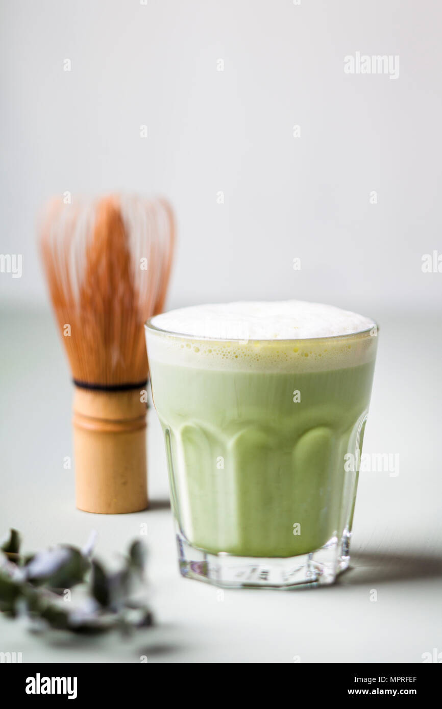 Matcha Latte in tea glass, chasen Stock Photo