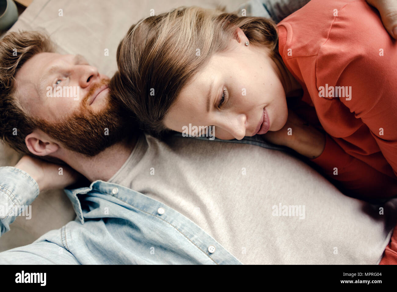 Affectionate couple cuddling at home Stock Photo