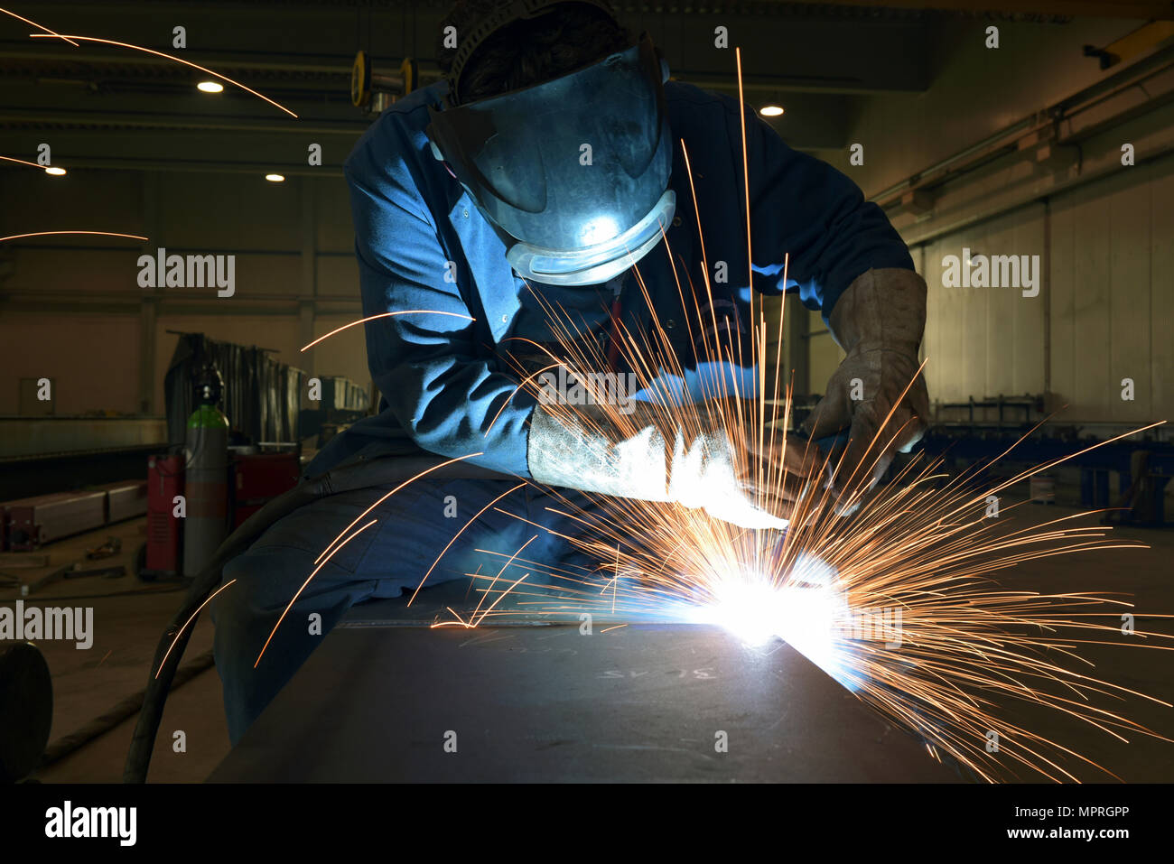 Welder at work in factory Stock Photo