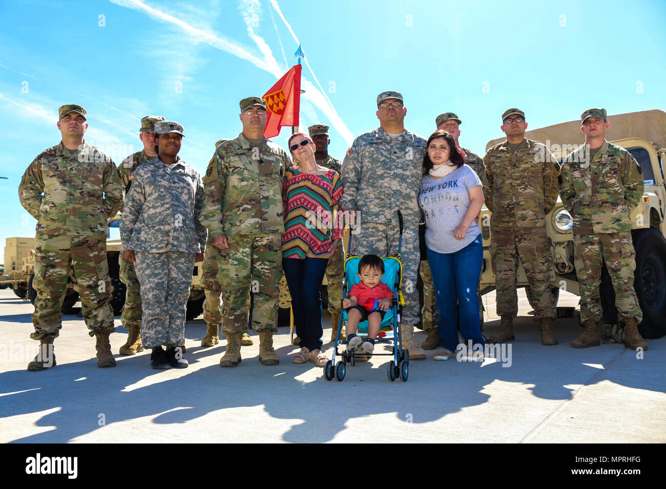 (Front and center, left to right) 1st Sgt. Victor Milam, Rustie Milam, Sgt. William Thomas Warren Jr., Nancy Nicole Adame-Warren, and William Ezra Warren, and Soldiers of Headquarters and Headquarters Battery, 32nd Army Air and Missile Defense Command, Fort Bliss, Texas, share their story of how they came together as the Army family through an emergency, April 6, 2017. The goal is to stay ready by assisting families inside and outside the unit’s element. (U.S. Army photo by Sgt. Aura E. Conejos, 32d AAMDC Public Affairs) Stock Photo