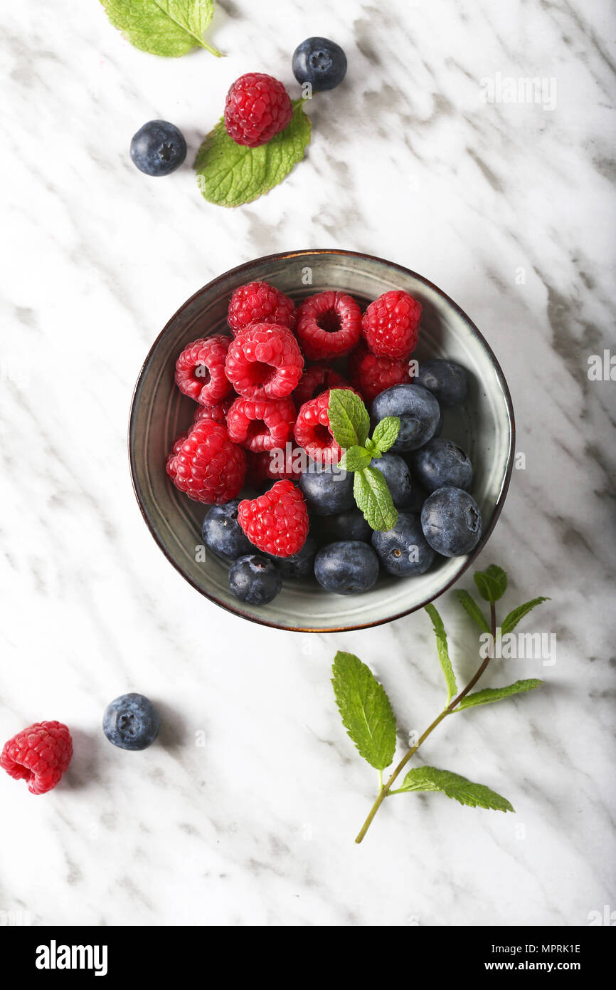 Bowl of blueberries and raspberries Stock Photo