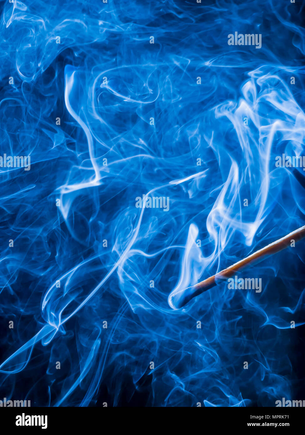 Smoke of blown out matchstick Stock Photo