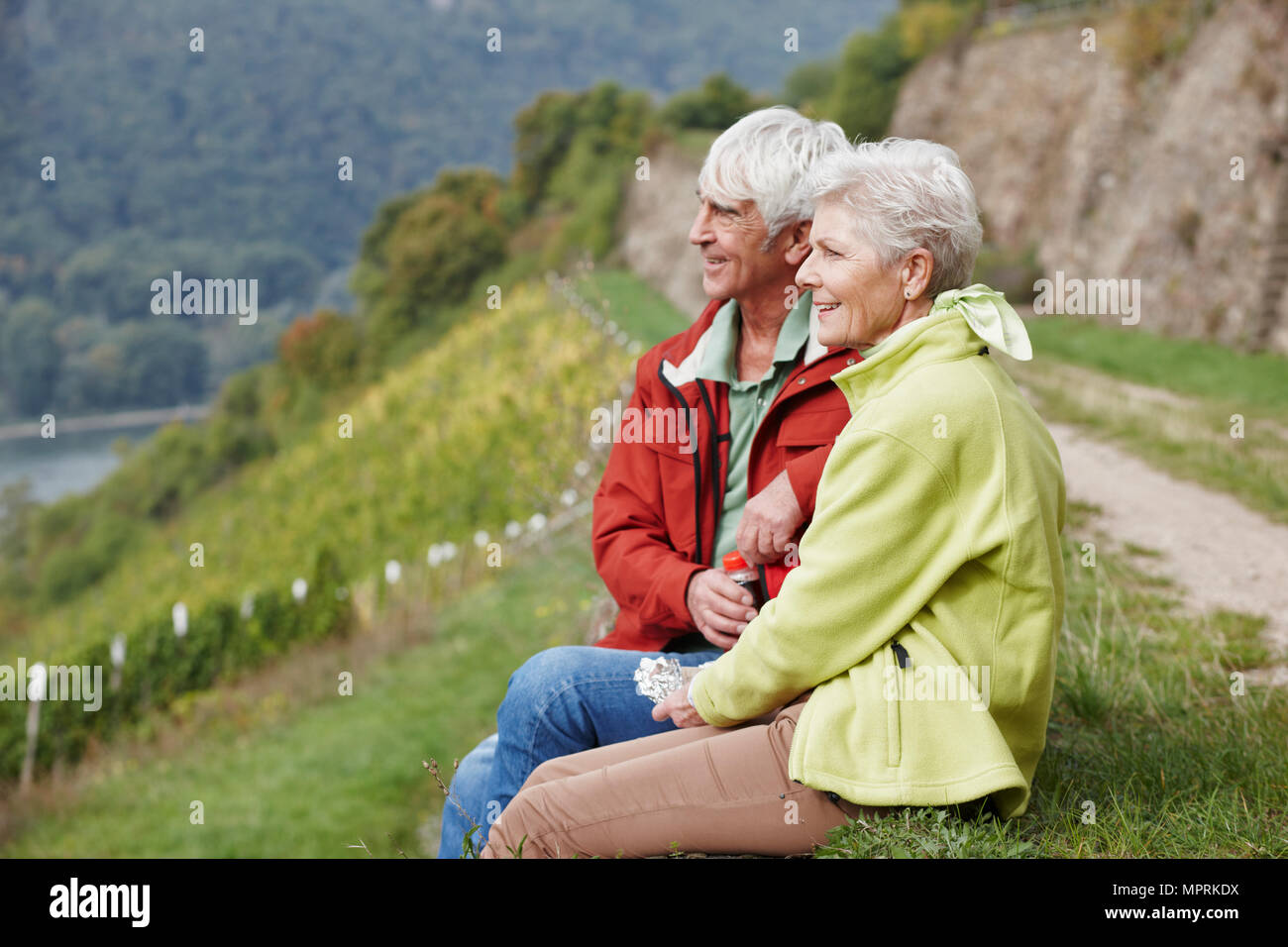 Germany, Rheingau, hiking senior couple having a rest Stock Photo