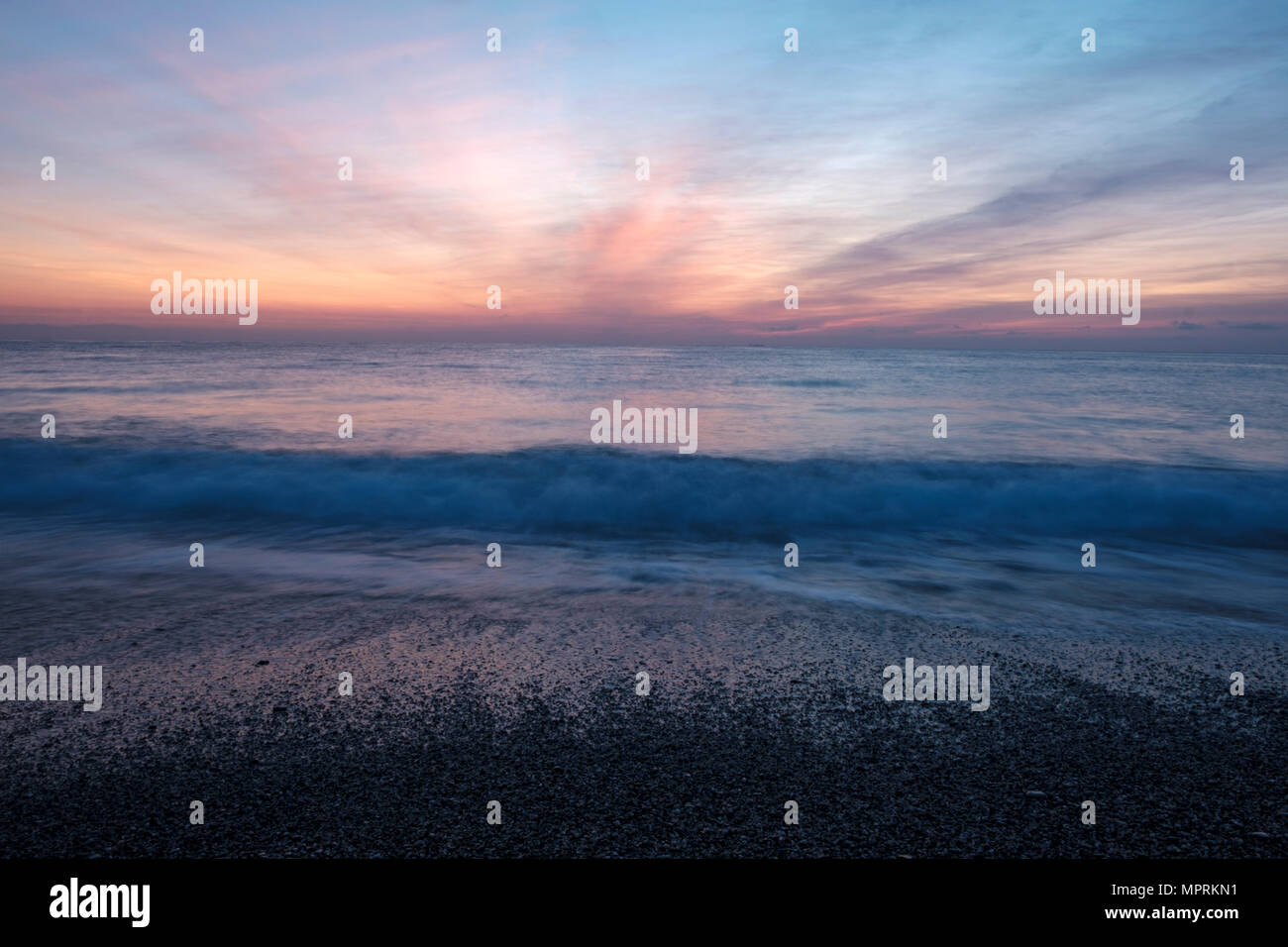 Italy, Liguria, Riviera di Ponente, Gulf of Genoa, Noli, sunrise at beach Stock Photo